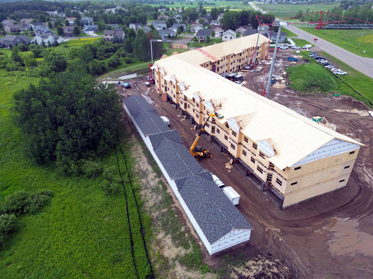 Long multifamily building framed and sheathed