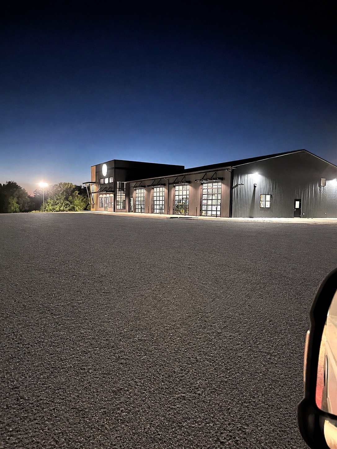 Commercial building at dusk with finished drive