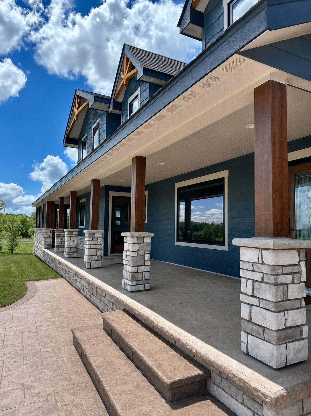 Covered porch with stone columns on a custom home