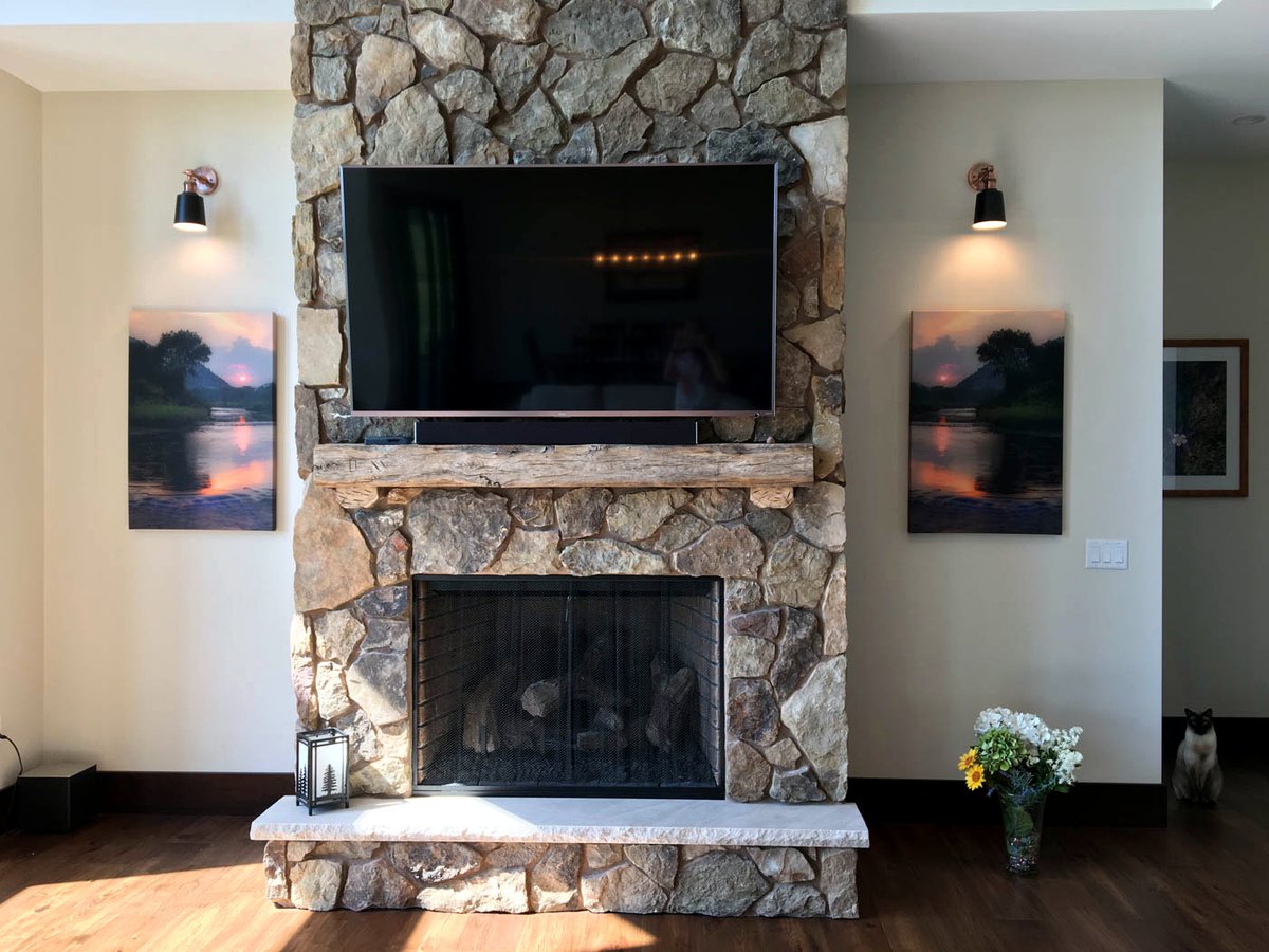 Great room with a floor-to-ceiling stone fireplace